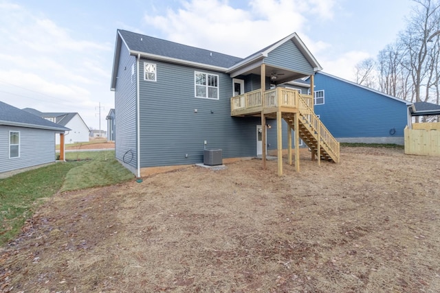 back of house with ceiling fan, central AC unit, and a deck