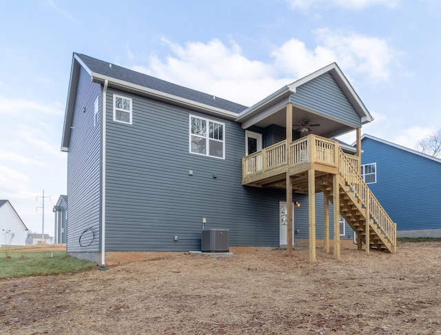 rear view of property with ceiling fan, central AC unit, and a deck