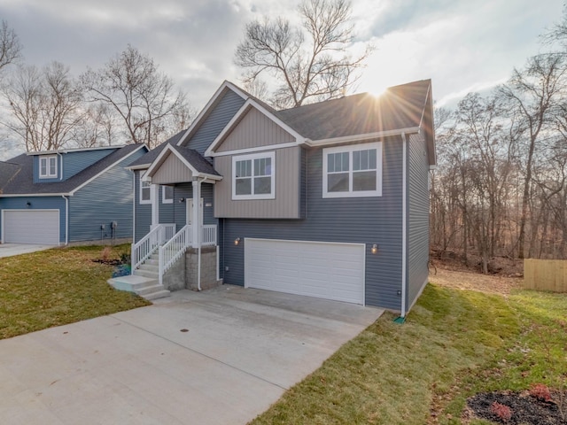 view of front of house featuring a front lawn and a garage