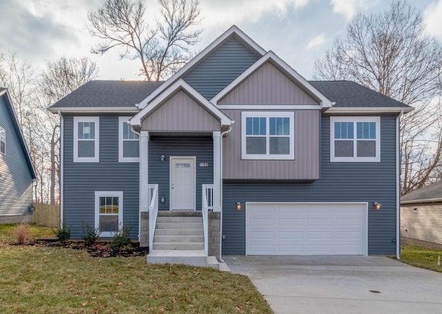 raised ranch featuring a front yard and a garage