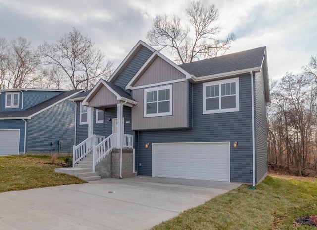 view of front of house with a front yard and a garage