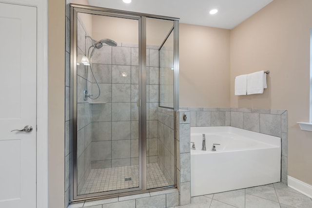 bathroom with tile patterned floors and separate shower and tub