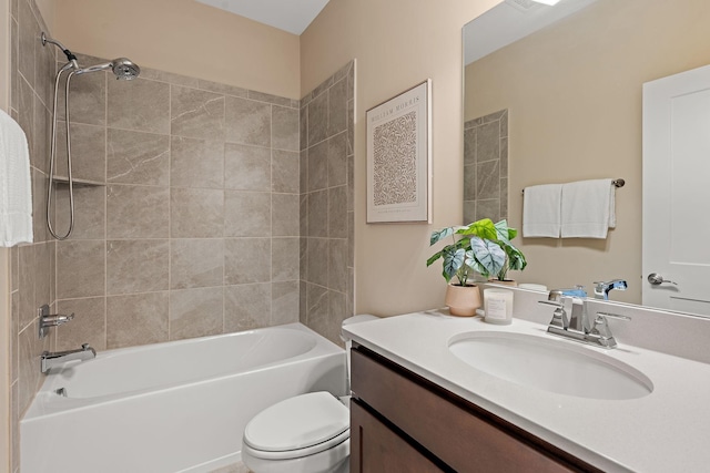 full bathroom featuring vanity, toilet, and tiled shower / bath combo