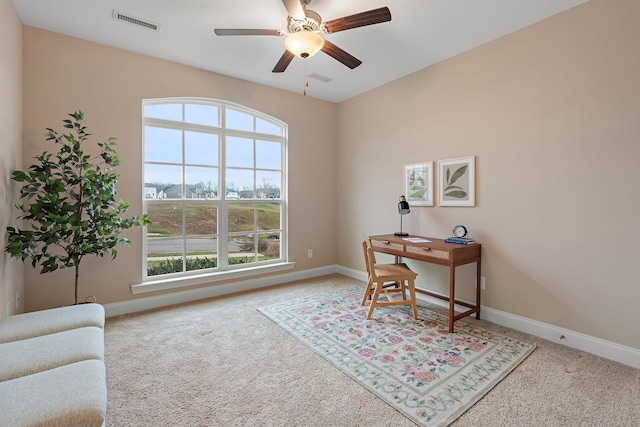 office area with carpet floors and ceiling fan