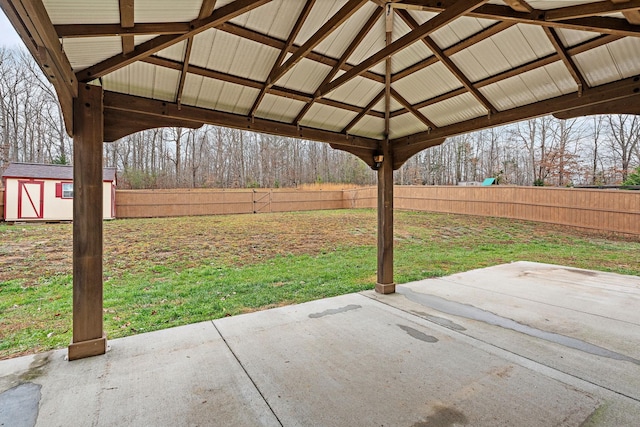 view of patio with a gazebo and a storage shed