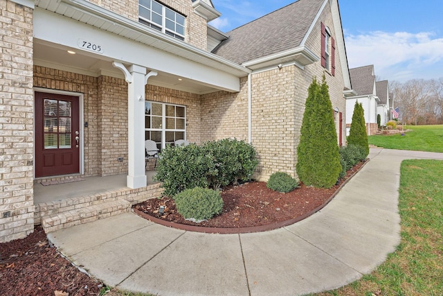 entrance to property featuring a porch