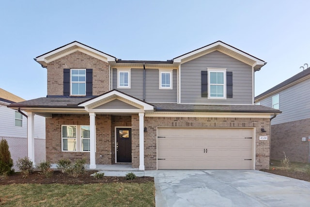 view of front of property with brick siding, driveway, an attached garage, and a shingled roof