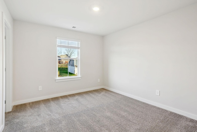 empty room featuring recessed lighting, visible vents, baseboards, and carpet flooring