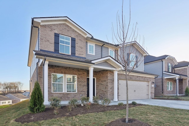 view of front facade featuring concrete driveway, a garage, brick siding, and a front yard