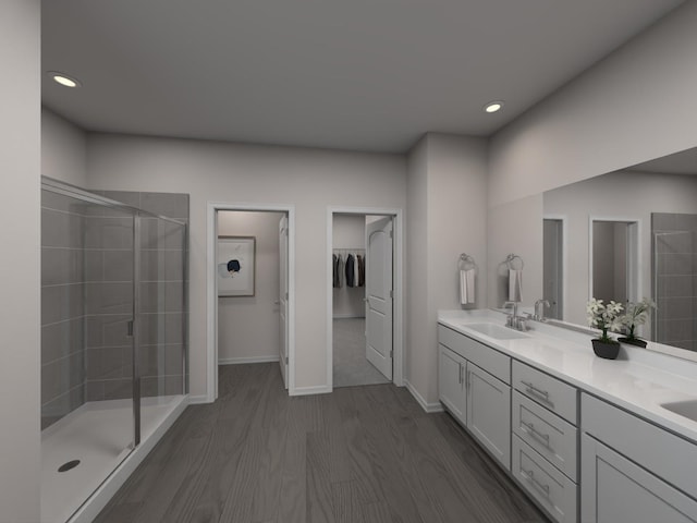 bathroom featuring vanity, hardwood / wood-style flooring, and a shower with door