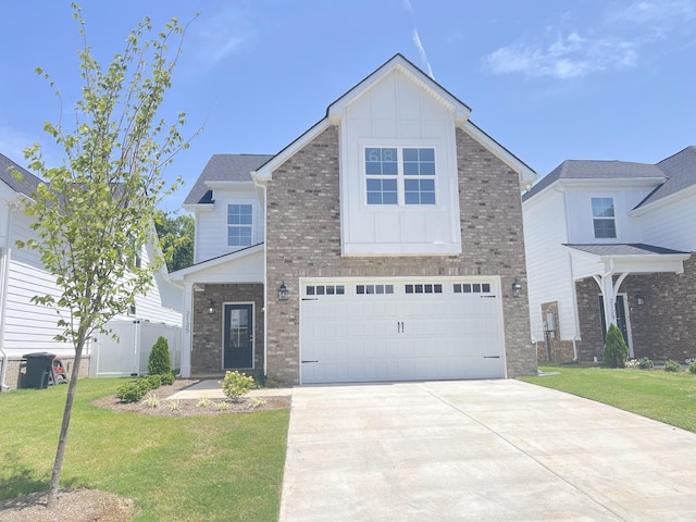 view of front of property with a front yard and a garage