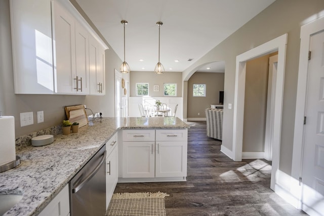 kitchen with kitchen peninsula, stainless steel dishwasher, dark hardwood / wood-style floors, light stone counters, and white cabinetry