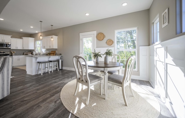 dining area featuring dark hardwood / wood-style flooring