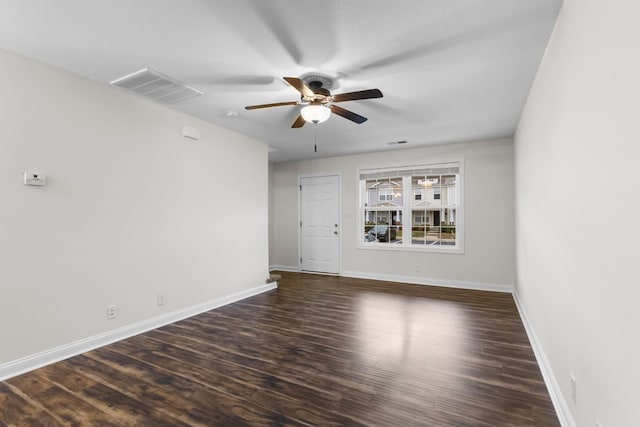 unfurnished room featuring dark hardwood / wood-style floors and ceiling fan