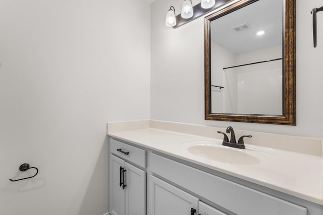 bathroom featuring vanity and walk in shower