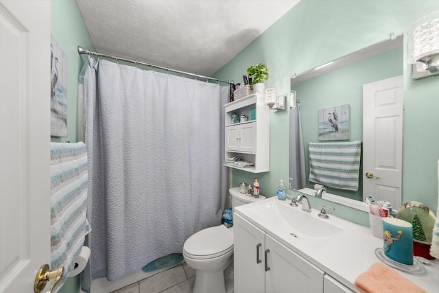 bathroom featuring vanity, tile patterned flooring, toilet, a textured ceiling, and walk in shower