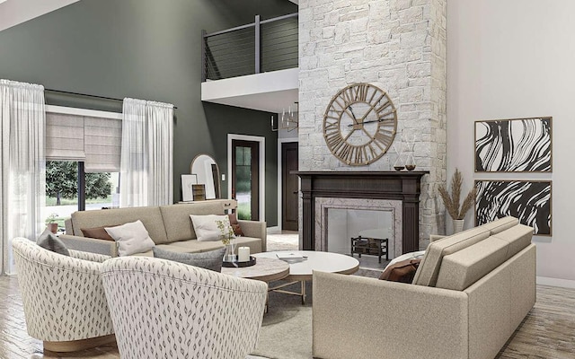 living room featuring light hardwood / wood-style floors, a stone fireplace, and a towering ceiling