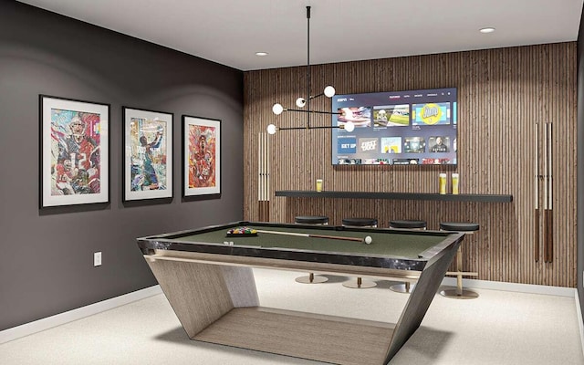 rec room with pool table and wood walls