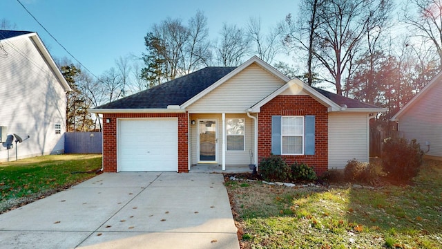 view of front of house with a front yard and a garage