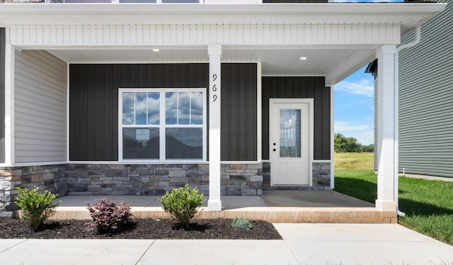 doorway to property featuring a porch