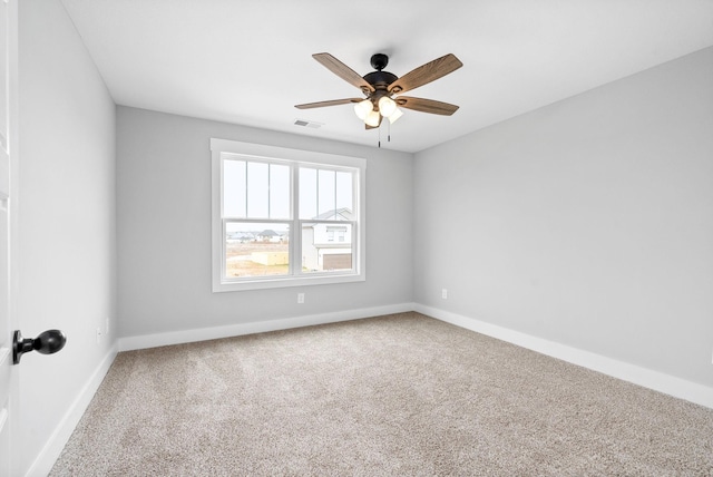 unfurnished room featuring carpet and ceiling fan