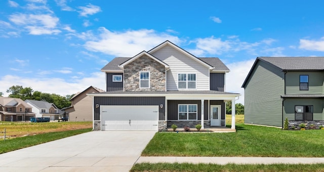 craftsman-style house with a garage and a front lawn