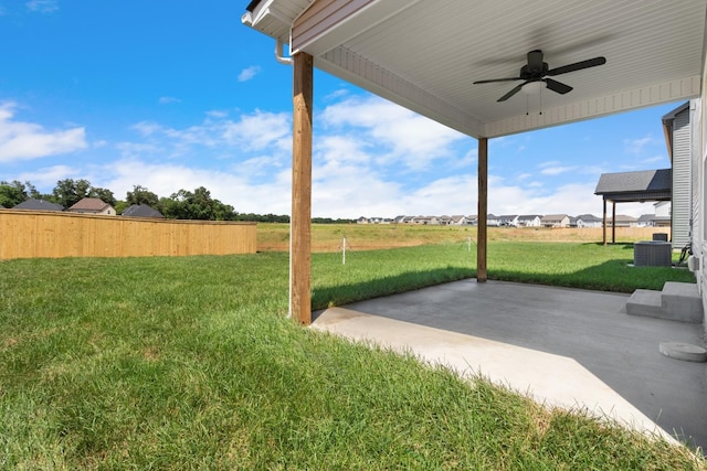 view of yard with a patio area and ceiling fan