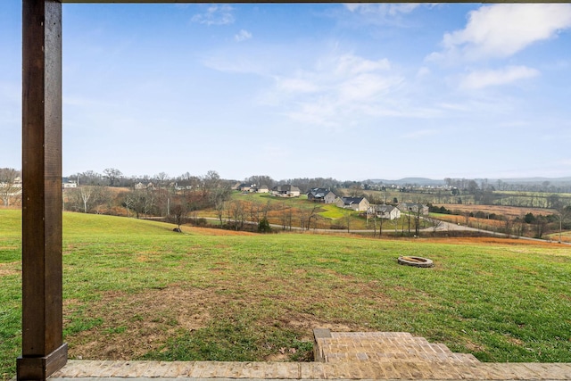 view of yard with a rural view