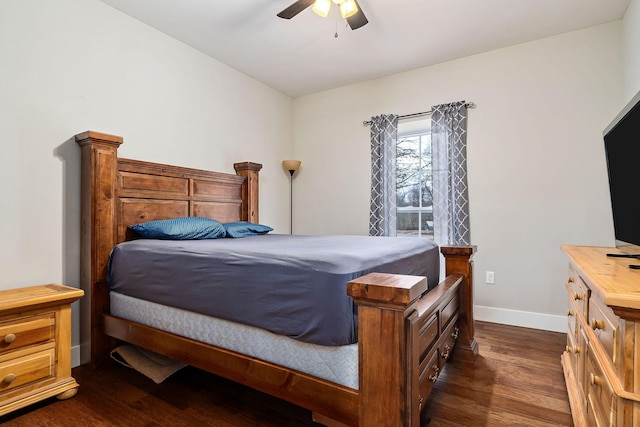 bedroom with ceiling fan and dark hardwood / wood-style floors