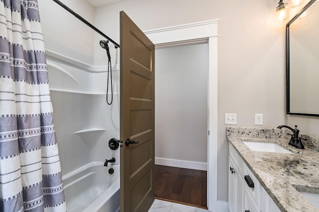 bathroom featuring vanity and shower / bathtub combination with curtain