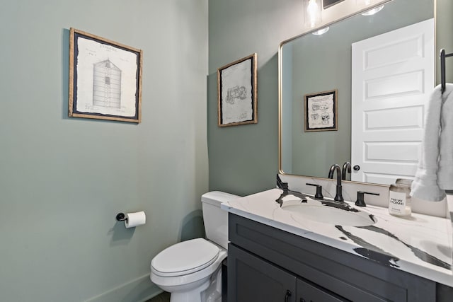 bathroom with toilet and vanity