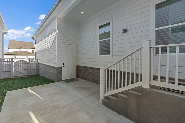 property entrance featuring a patio