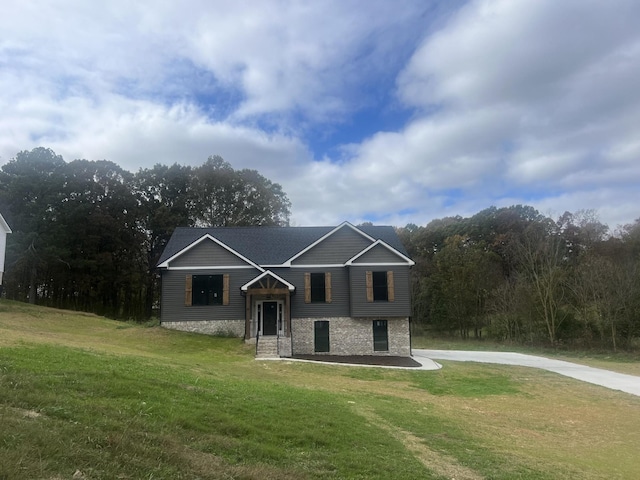 raised ranch with a front lawn