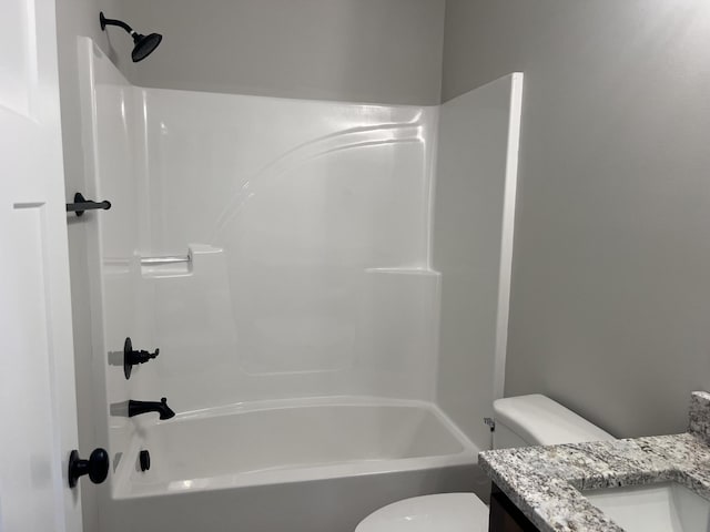 full bathroom with vanity, washtub / shower combination, and toilet