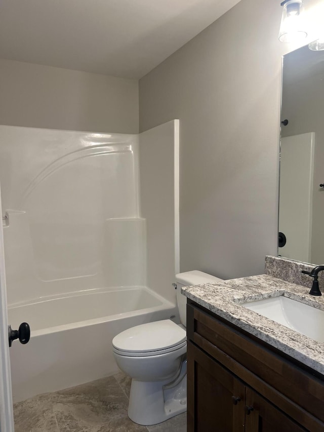 full bathroom featuring vanity, bathing tub / shower combination, and toilet