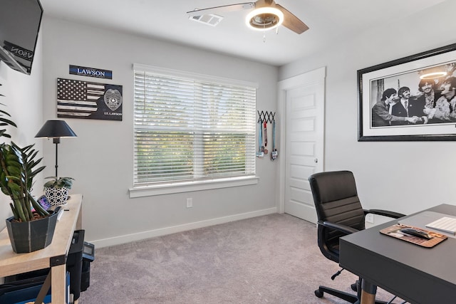 carpeted home office with ceiling fan