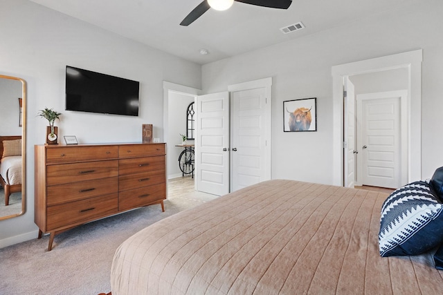 carpeted bedroom with ceiling fan