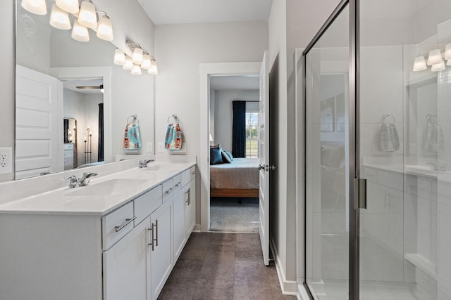 bathroom with vanity and a shower with door