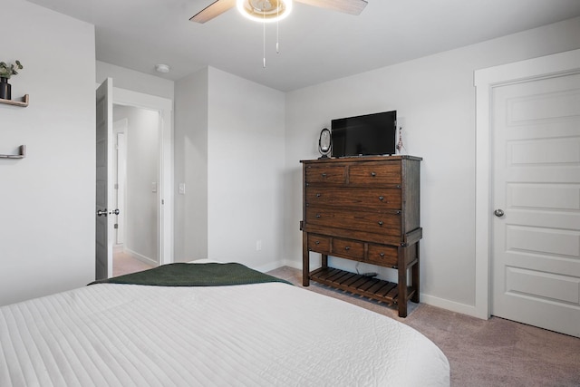 bedroom with ceiling fan and light colored carpet