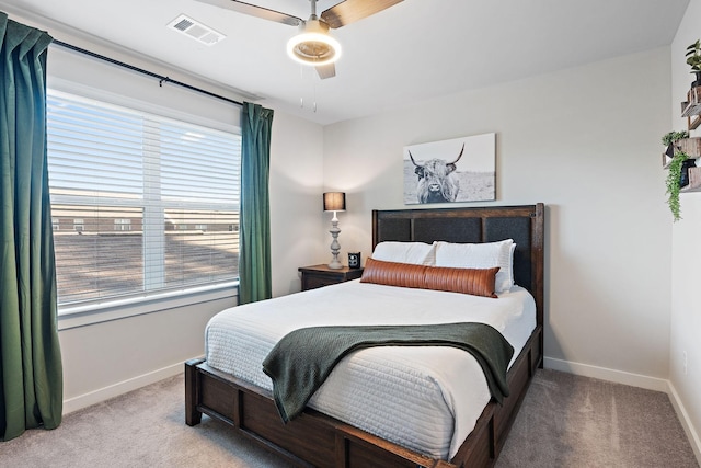 carpeted bedroom with ceiling fan