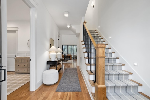 stairway featuring wood-type flooring