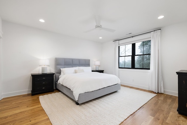 bedroom featuring hardwood / wood-style flooring and ceiling fan