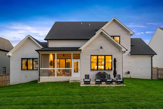 back of house featuring an outdoor living space, a yard, and a patio area