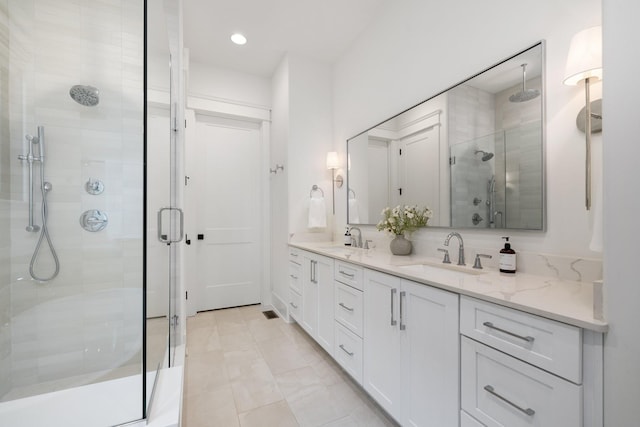 bathroom featuring vanity and walk in shower