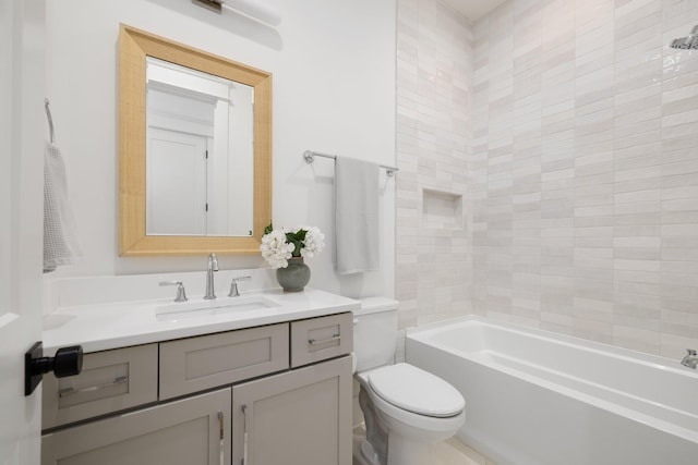 full bathroom with tiled shower / bath combo, vanity, and toilet