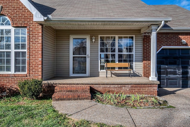 view of exterior entry with covered porch