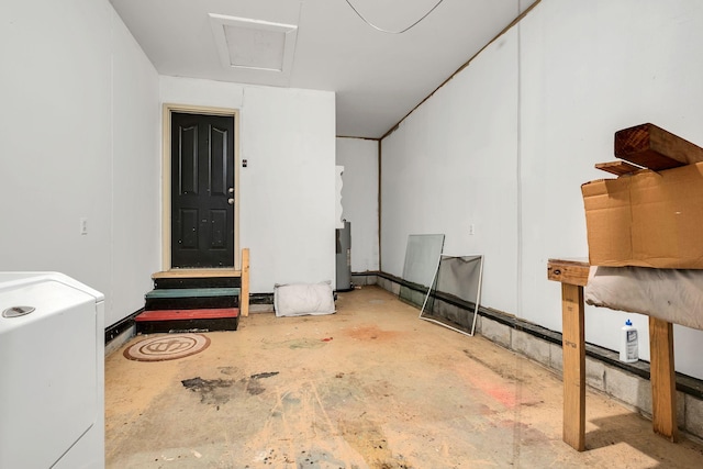 garage featuring washer / clothes dryer and water heater