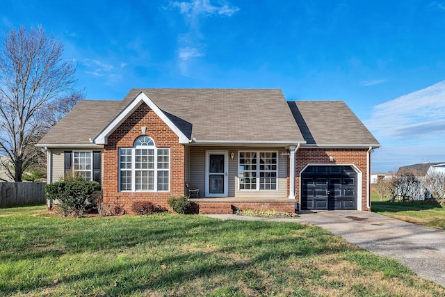 view of front of home featuring a front lawn and a garage