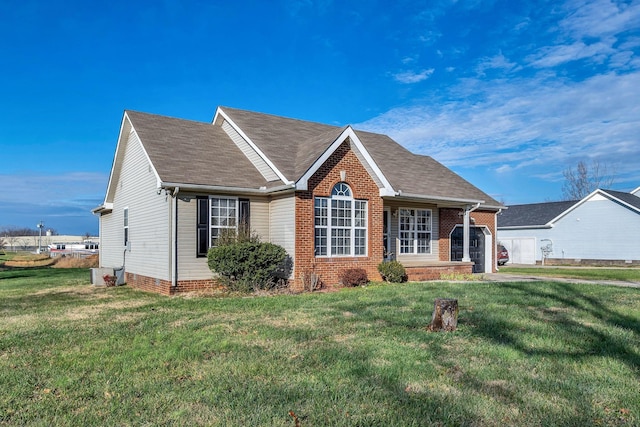 view of front of home featuring a garage and a front lawn