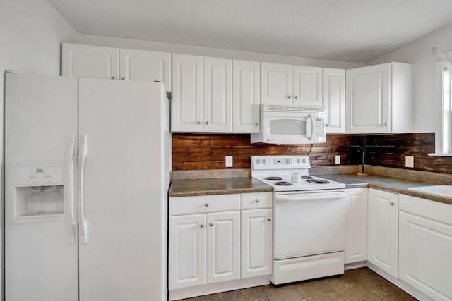 kitchen featuring white cabinets, white appliances, and backsplash